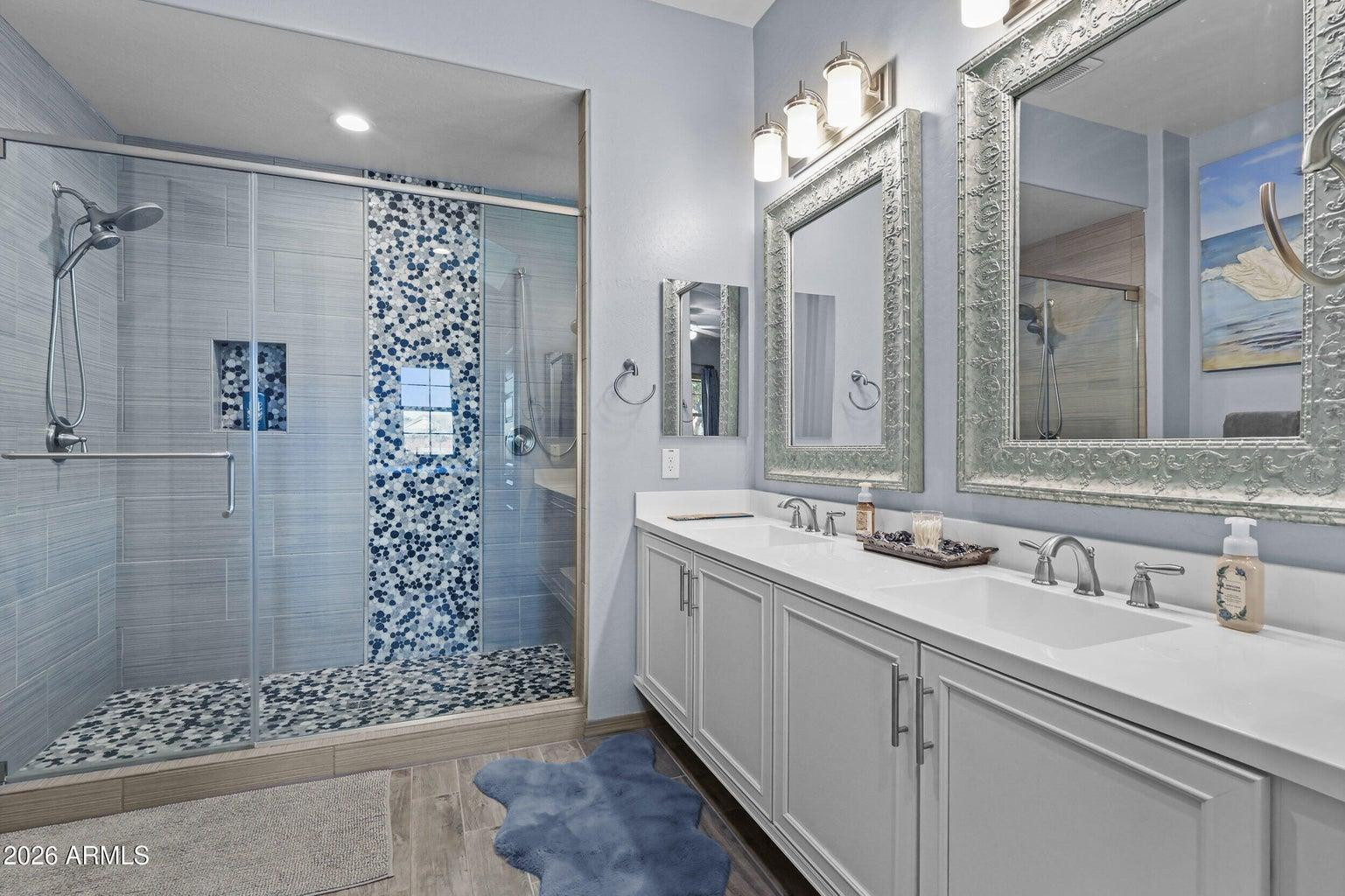 4451 East Bernice Street Gilbert, AZ 85295 - Photo 15 of 32 a bathroom with a double vanity sink mirror and shower