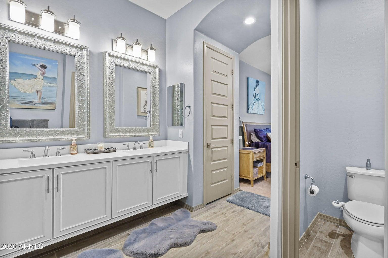 4451 East Bernice Street Gilbert, AZ 85295 - Photo 16 of 32 a bathroom with a sink a toilet and shower