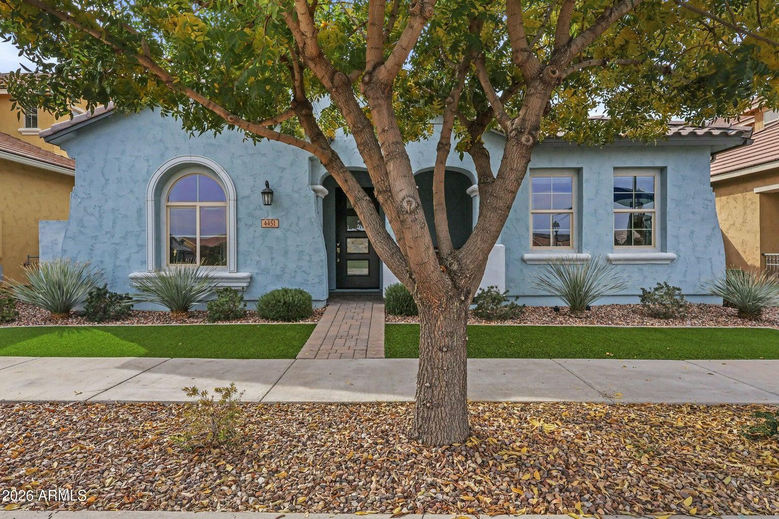 4451 East Bernice Street Gilbert, AZ 85295 - Photo 2 of 32 a front view of a house with a yard