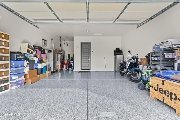 a view of a garage with rack and bicycle