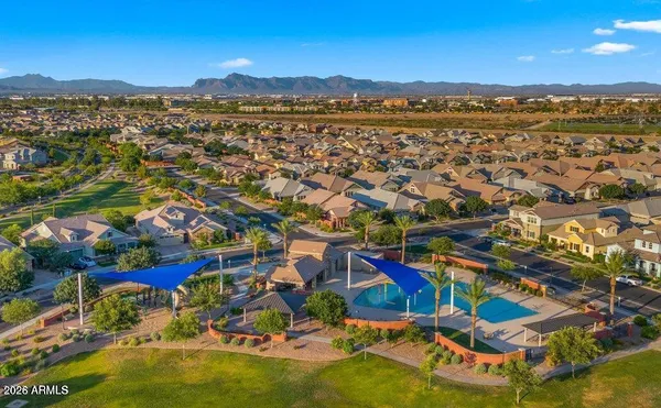 an aerial view of residential houses with outdoor space