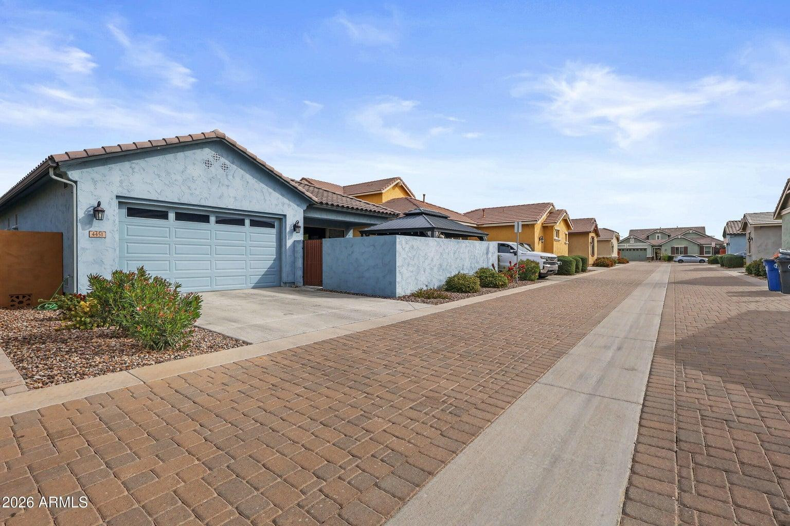 4451 East Bernice Street Gilbert, AZ 85295 - Photo 29 of 32 a view of a house with a small yard and large trees