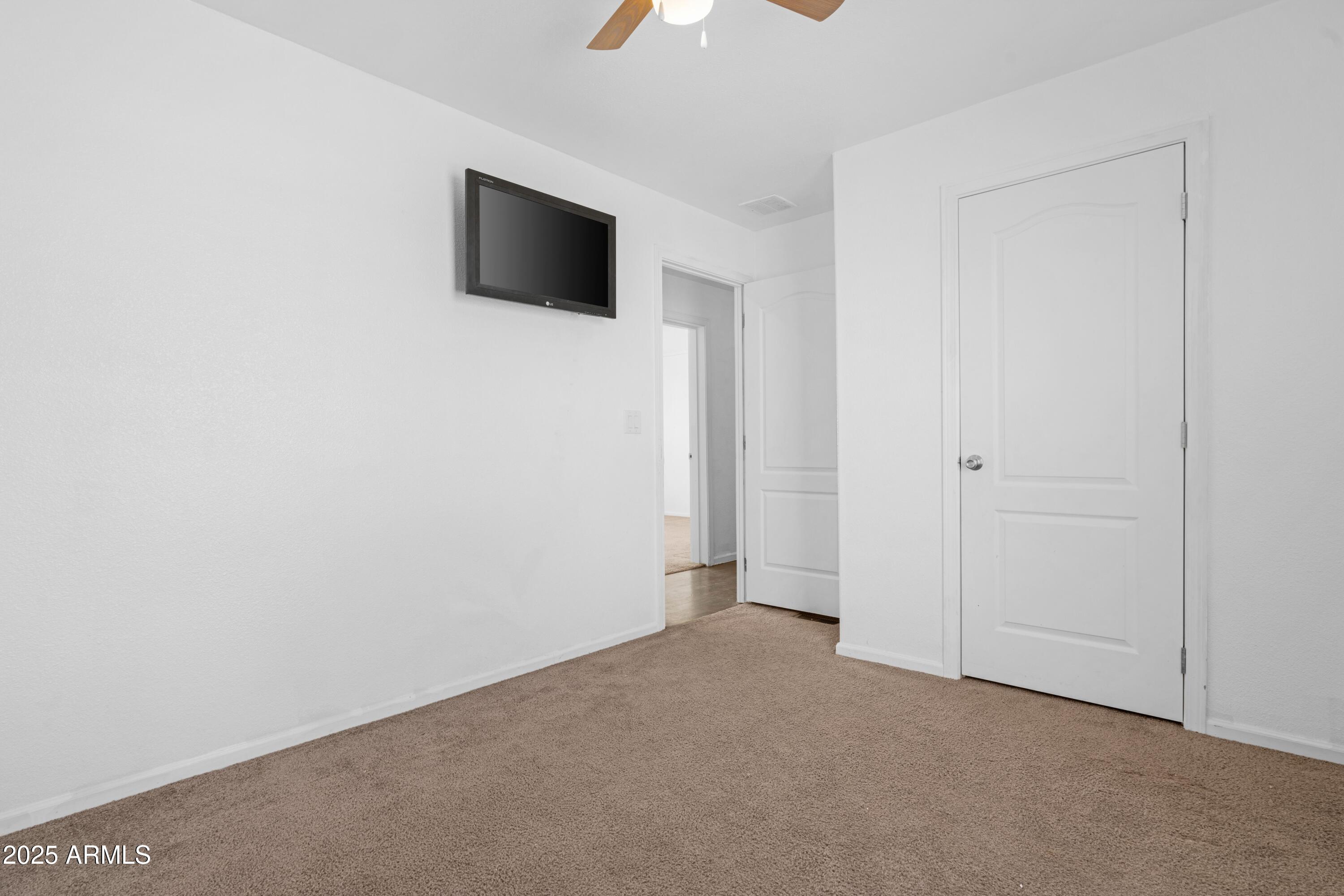 4318 North White Road Maricopa, AZ 85139 - Photo 14 of 21 a view of a livingroom with a flat screen tv