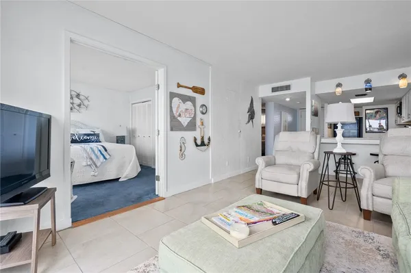 a bedroom with a bed and a couch