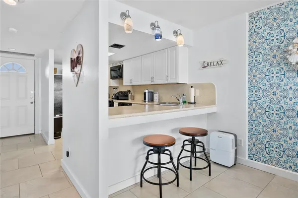 a living room with furniture tv and a window