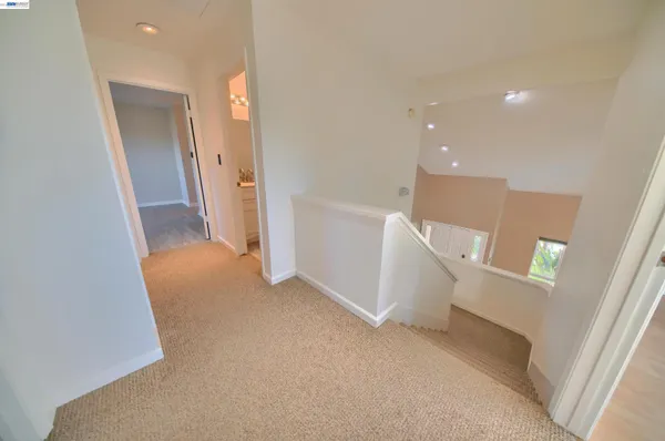 a view of an empty room with a fireplace