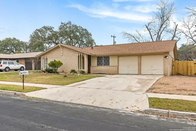 a house with trees in the background