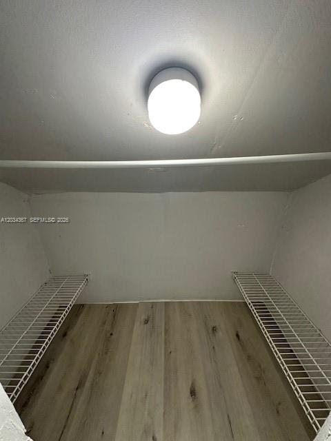 274 East 9th Street, Unit 4 Hialeah, FL 33010 - Photo 8 of 15 an empty room with wooden floor