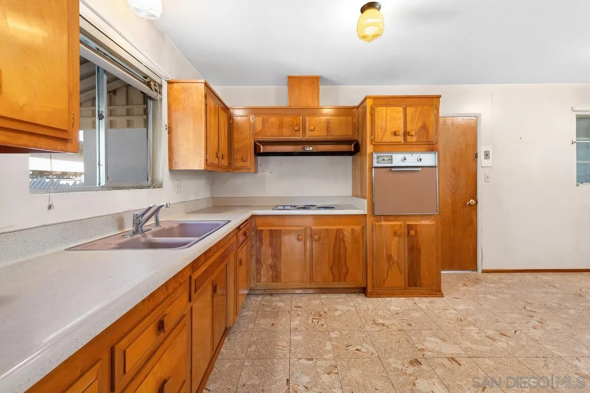 1119 Buckskin Road El Cajon, CA 92019 - Photo 12 of 27 a bathroom with a granite countertop sink and a mirror