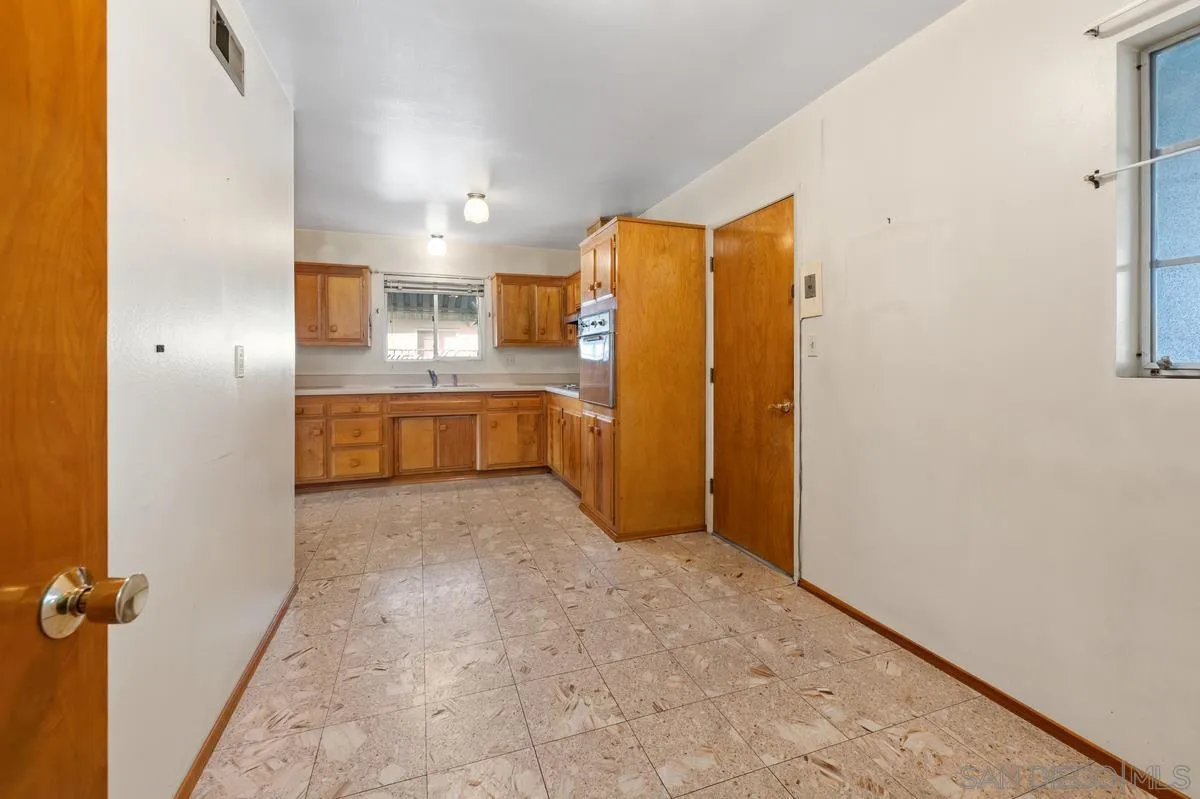 1119 Buckskin Road El Cajon, CA 92019 - Photo 13 of 27 a bathroom with a granite countertop sink and a mirror