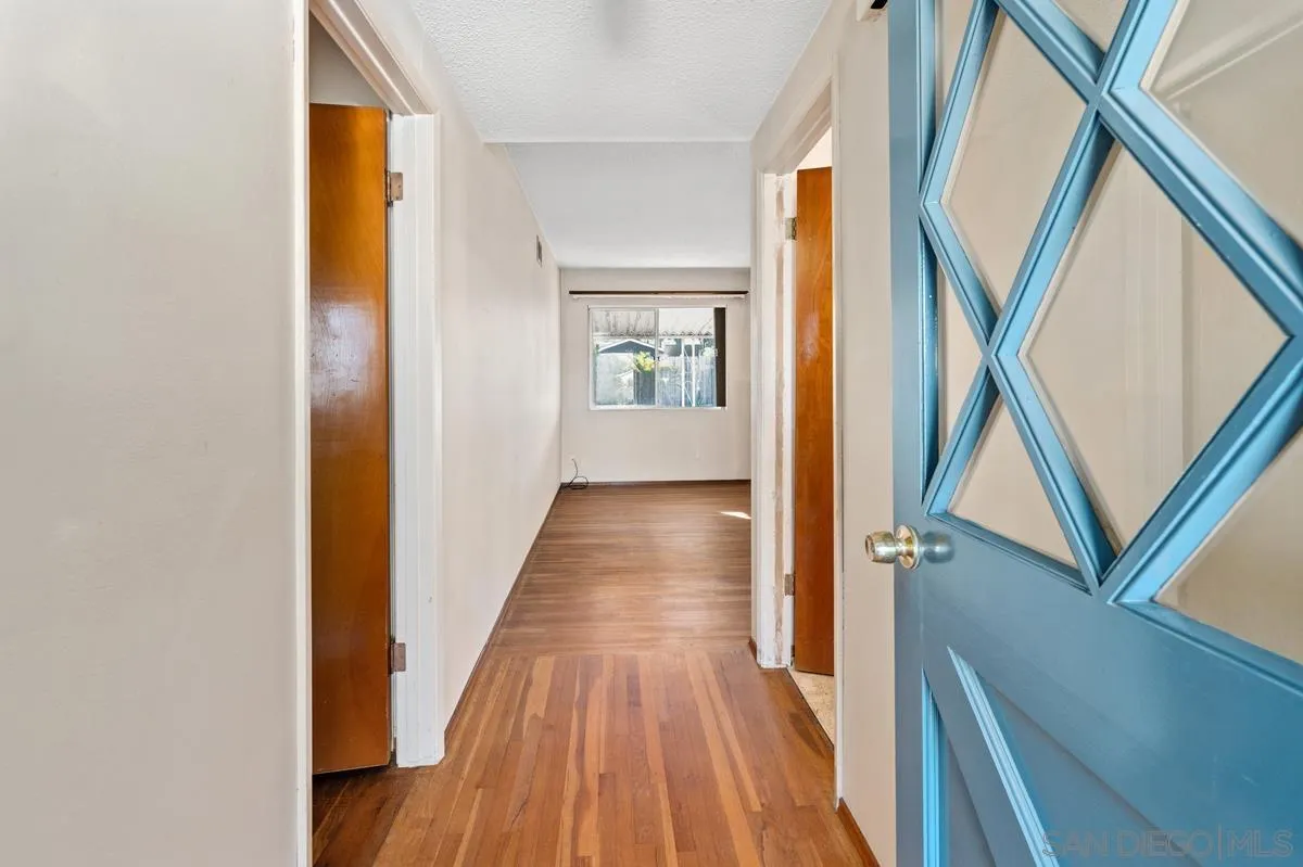 1119 Buckskin Road El Cajon, CA 92019 - Photo 5 of 27 a view of a hallway with wooden floor and staircase