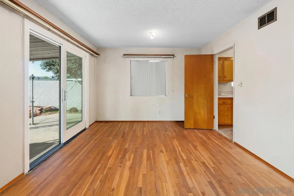 1119 Buckskin Road El Cajon, CA 92019 - Photo 8 of 27 wooden floor in an empty room with a window
