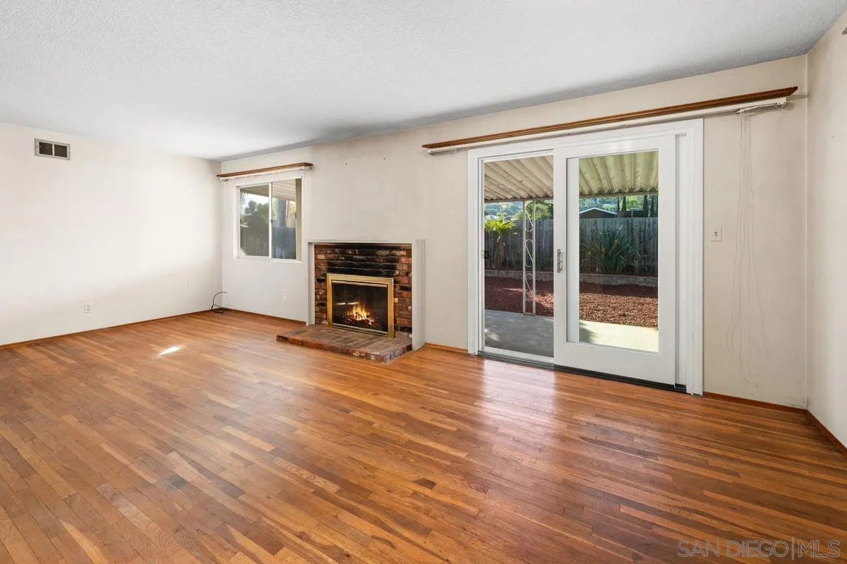 1119 Buckskin Road El Cajon, CA 92019 - Photo 10 of 27 a view of empty room with wooden floor and fan
