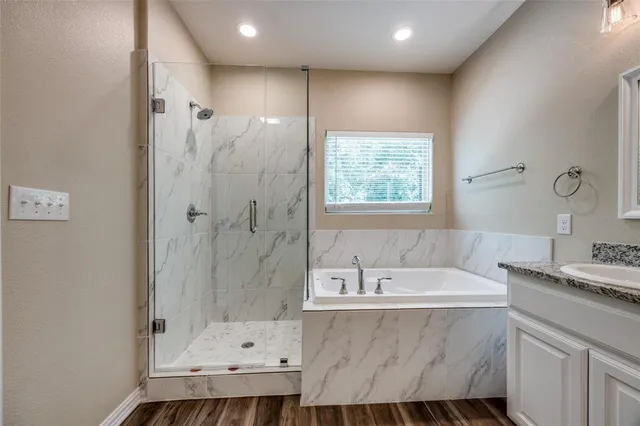 a bathroom with a bathtub and a sink
