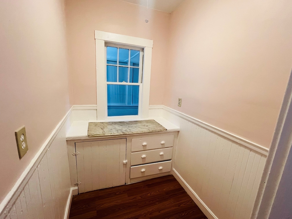 62 Westmore Road, Unit 2 Boston, MA 02126 - Photo 6 of 13 a view of storage and utility room with wooden floor