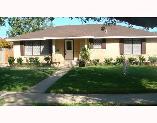 a black and white house with a yard
