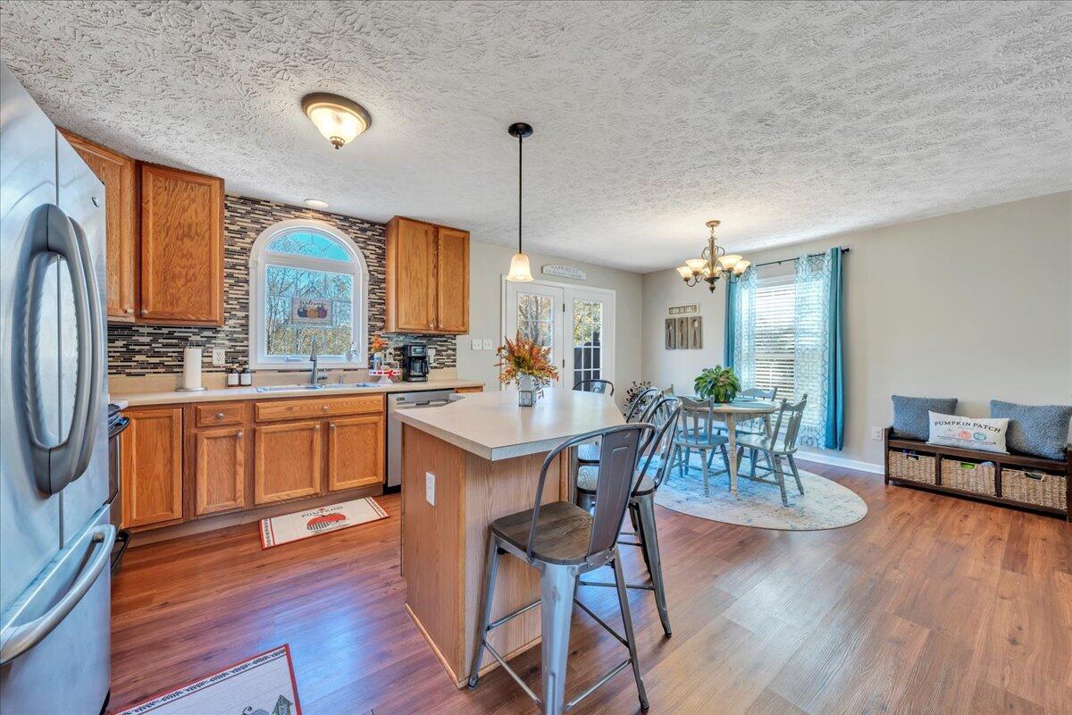 780 Farmington Road Hardy, VA 24101 - Photo 15 of 50 a large kitchen with a large window and stainless steel appliances