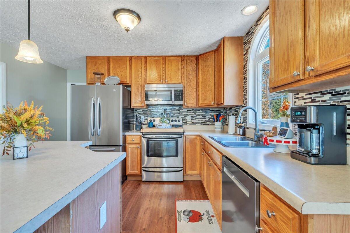 780 Farmington Road Hardy, VA 24101 - Photo 16 of 50 a kitchen with stainless steel appliances a sink window and refrigerator
