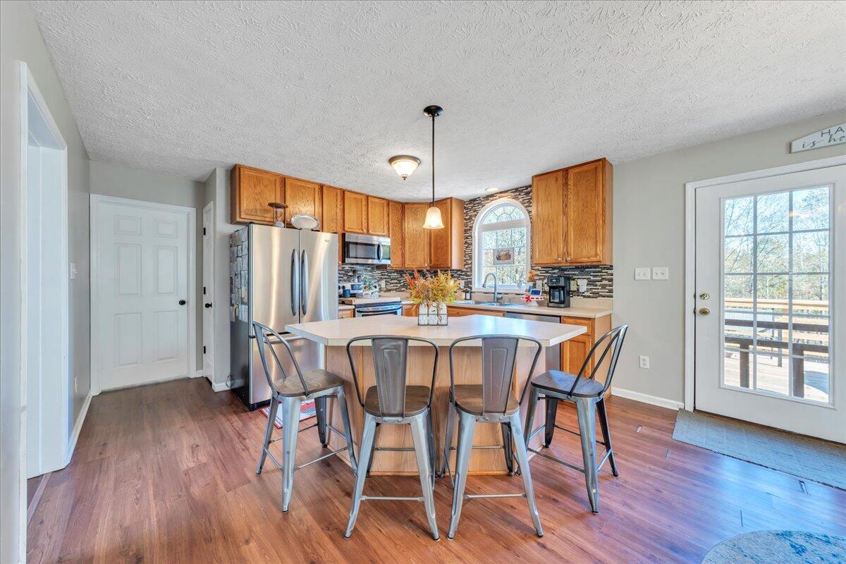 780 Farmington Road Hardy, VA 24101 - Photo 3 of 50 a view of a dining room with furniture window and wooden floor