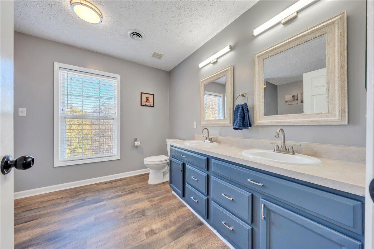 780 Farmington Road Hardy, VA 24101 - Photo 33 of 50 a spacious bathroom with a granite countertop sink and a mirror