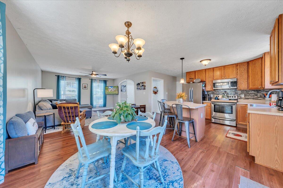 780 Farmington Road Hardy, VA 24101 - Photo 4 of 50 a view of a dining room with furniture a rug and wooden floor