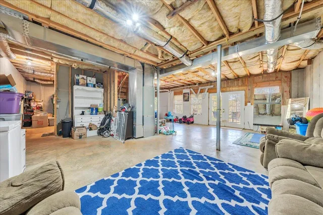 a lobby with furniture and rug