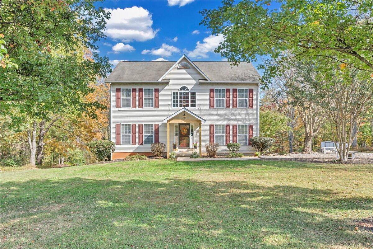 780 Farmington Road Hardy, VA 24101 - Photo 8 of 50 a front view of a house with a yard