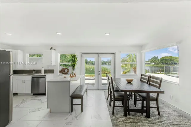 a view of a dining room with furniture window and outside view