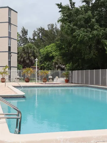 a front view of a house with sitting area