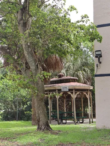 a view of a wooden deck with furniture