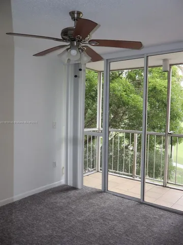 a view of empty room with floor to ceiling window