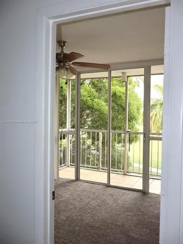 a view of a room with a large window