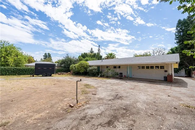 a house with trees in front of it