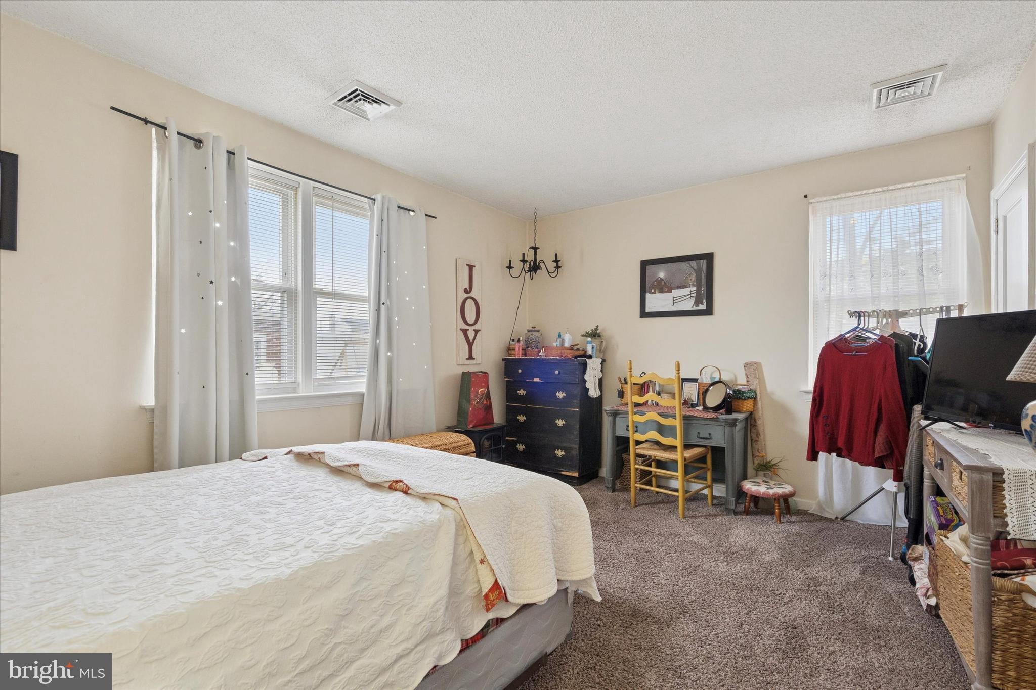 9208 Exeter Road Philadelphia, PA 19114 - Photo 11 of 15 a bedroom with a bed and furniture