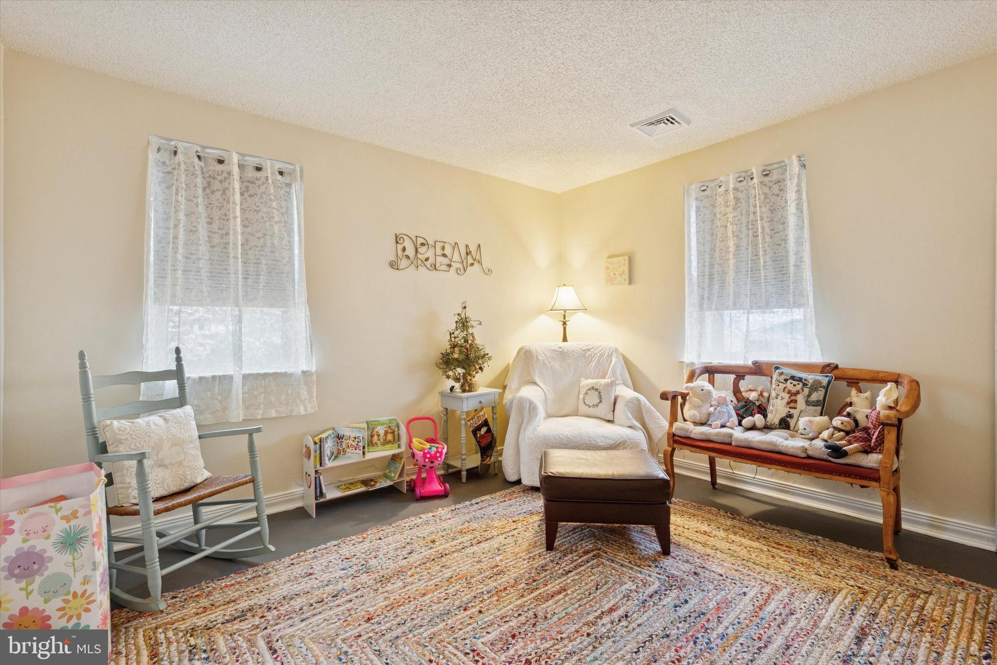 9208 Exeter Road Philadelphia, PA 19114 - Photo 12 of 15 a living room with furniture and a rug