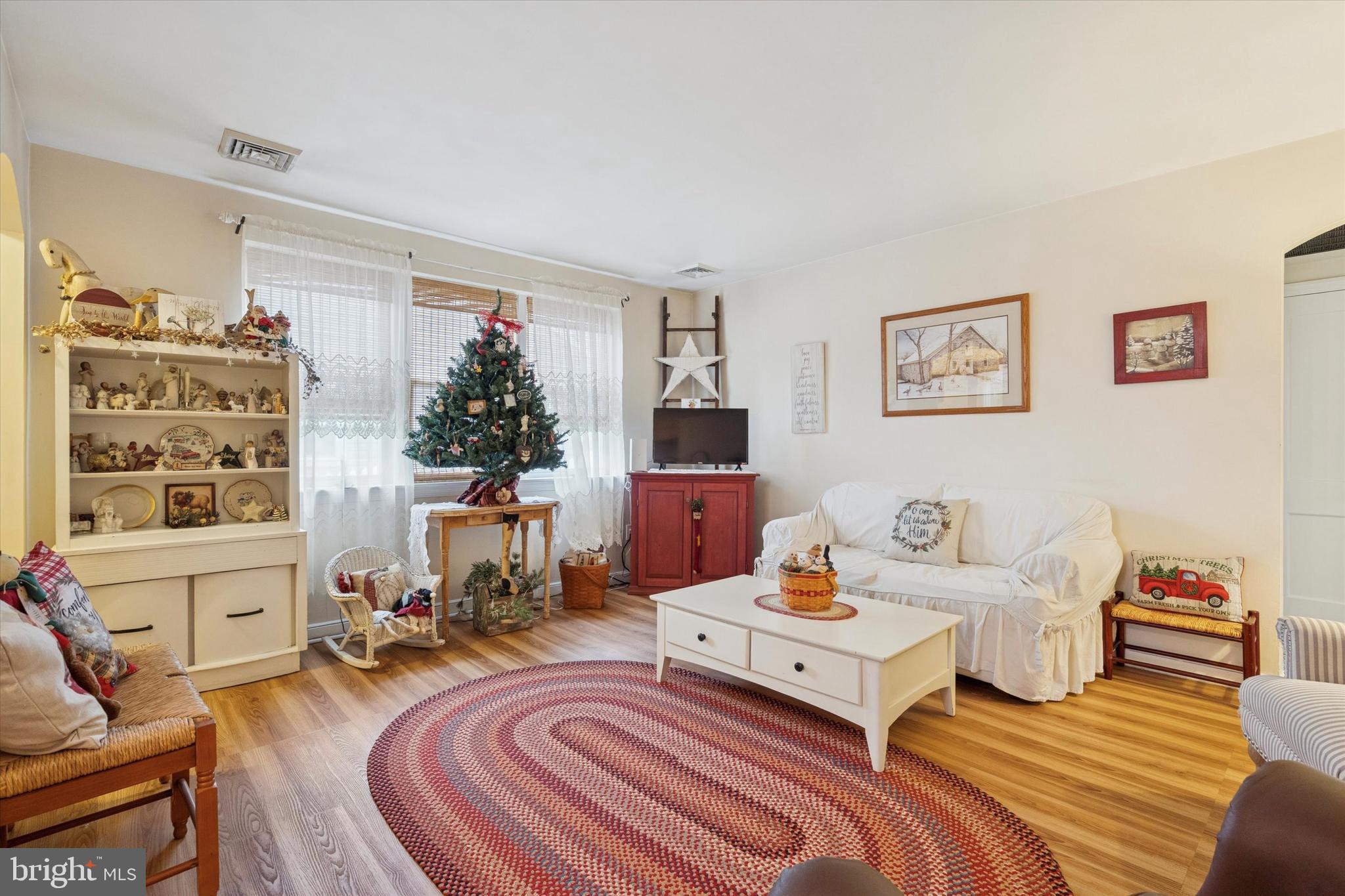 9208 Exeter Road Philadelphia, PA 19114 - Photo 5 of 15 a living room with furniture fireplace and a window