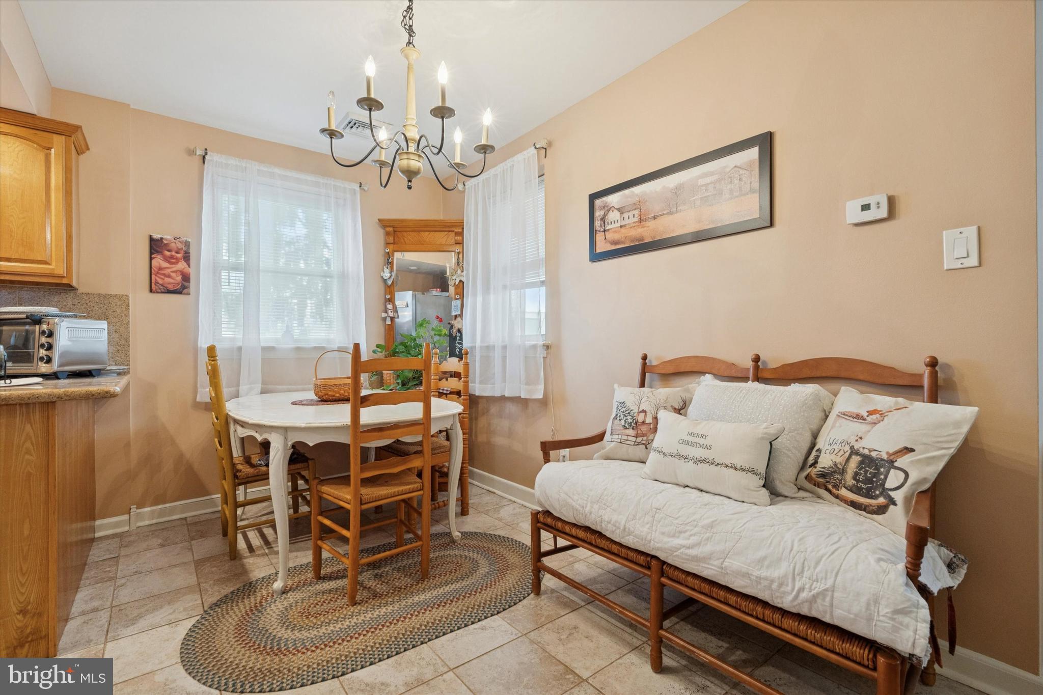 9208 Exeter Road Philadelphia, PA 19114 - Photo 6 of 15 a living room with furniture and a chandelier