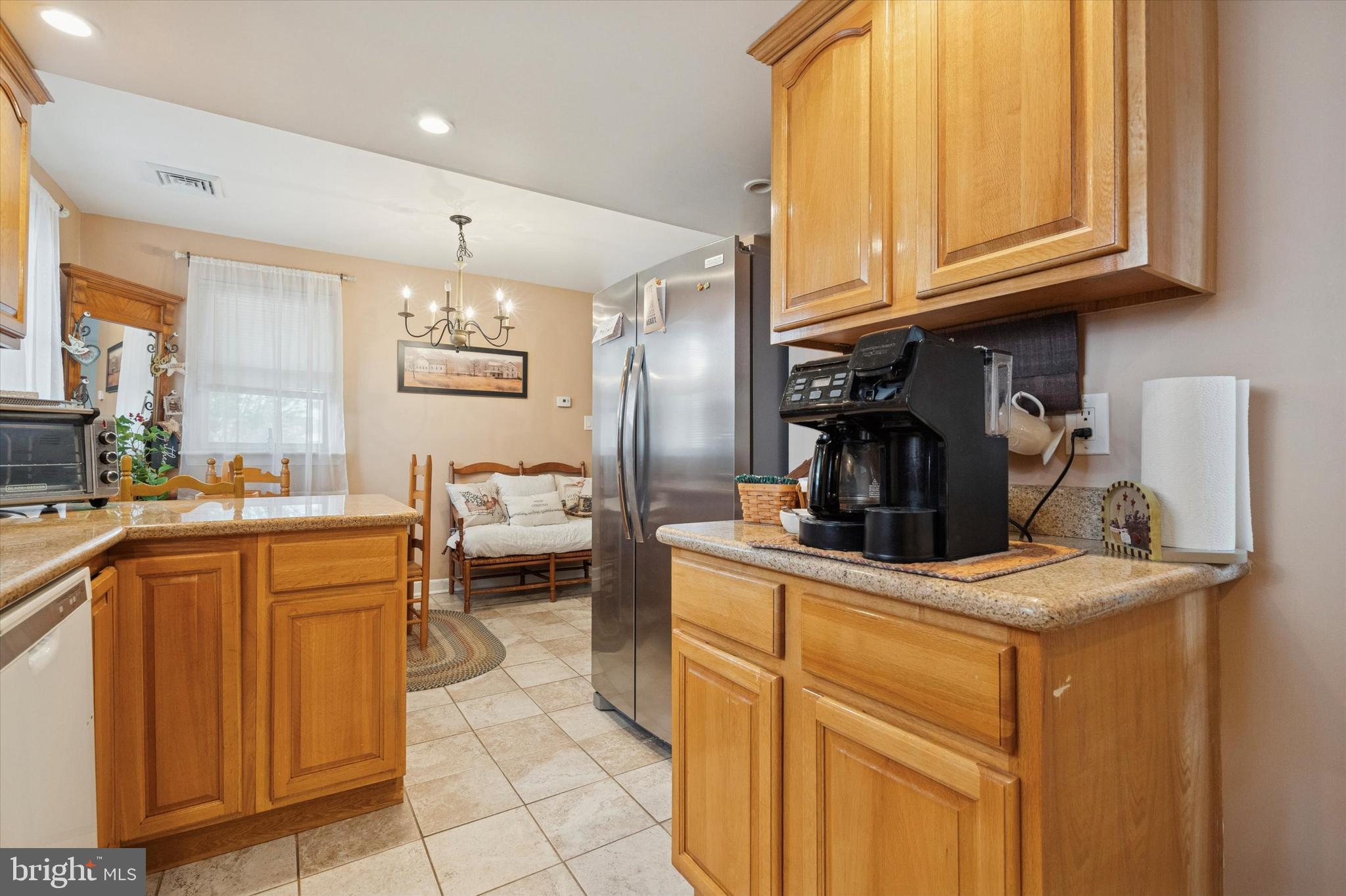 9208 Exeter Road Philadelphia, PA 19114 - Photo 10 of 15 a kitchen with stainless steel appliances granite countertop a sink and cabinets