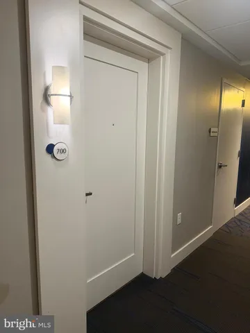 a view of a hallway with washer and dryer