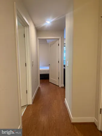 a view of a living room with a wooden floor