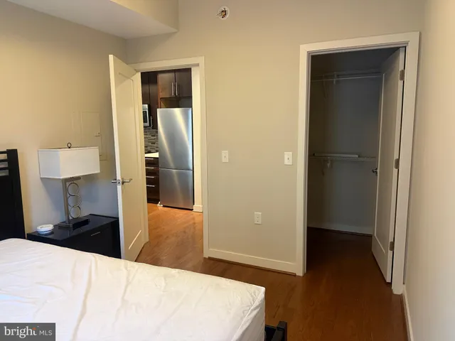 a kitchen with stainless steel appliances a stove a sink and a refrigerator
