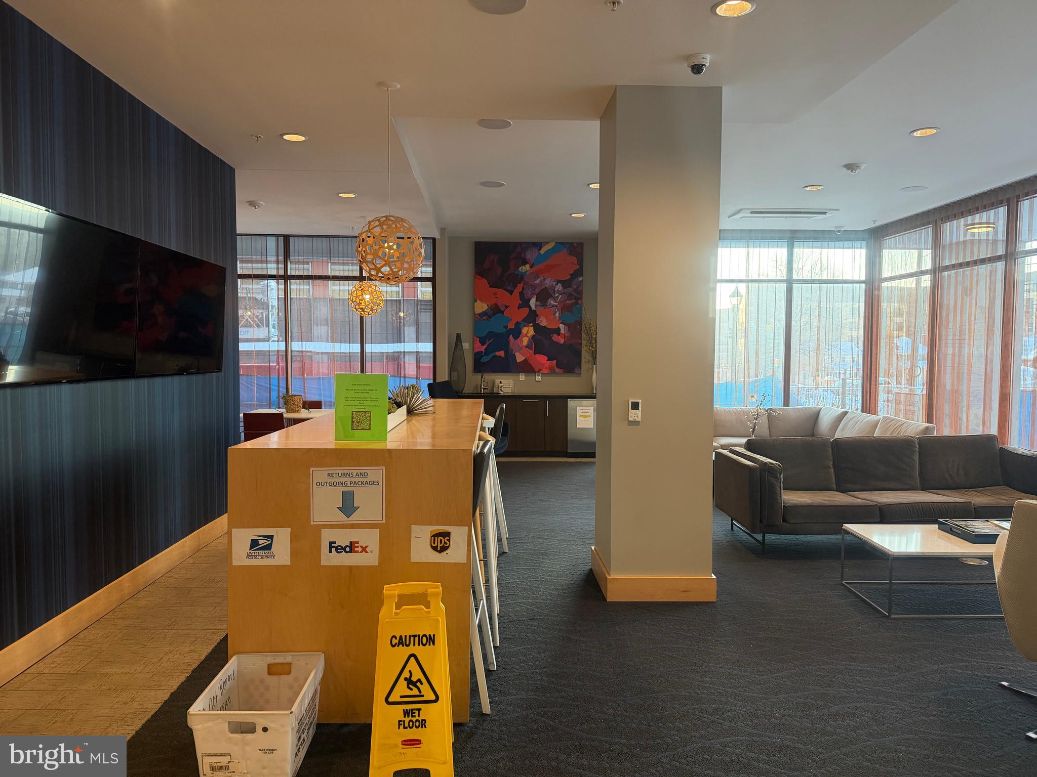 1320 Fenwick Lane, Unit 700 Silver Spring, MD 20910 - Photo 7 of 25 a living room with furniture and a flat screen tv