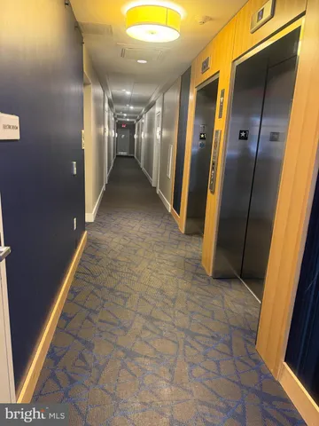 a view of hallway with a glass door