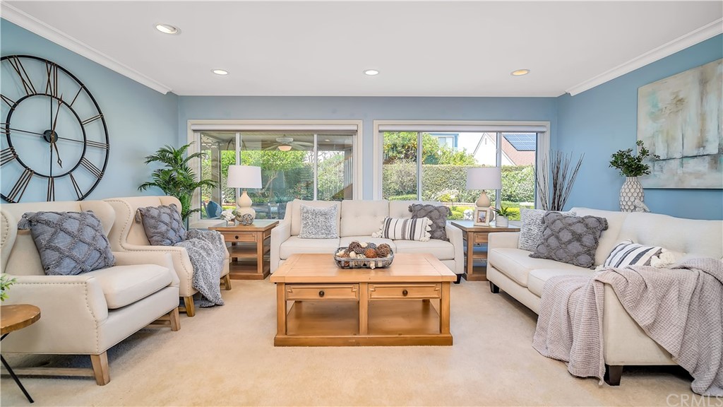2301 Caper Tree Drive Tustin, CA 92780 - Photo 1 of 29 a living room with furniture and a large window