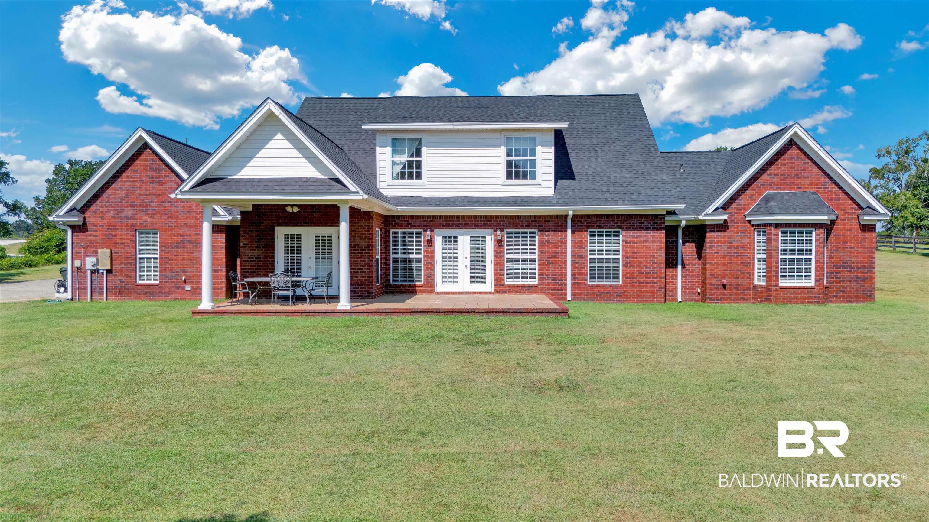27688 Rigsby Road Daphne, AL 36526 - Photo 48 of 56 Exterior space with a lawn, a patio, and french doors