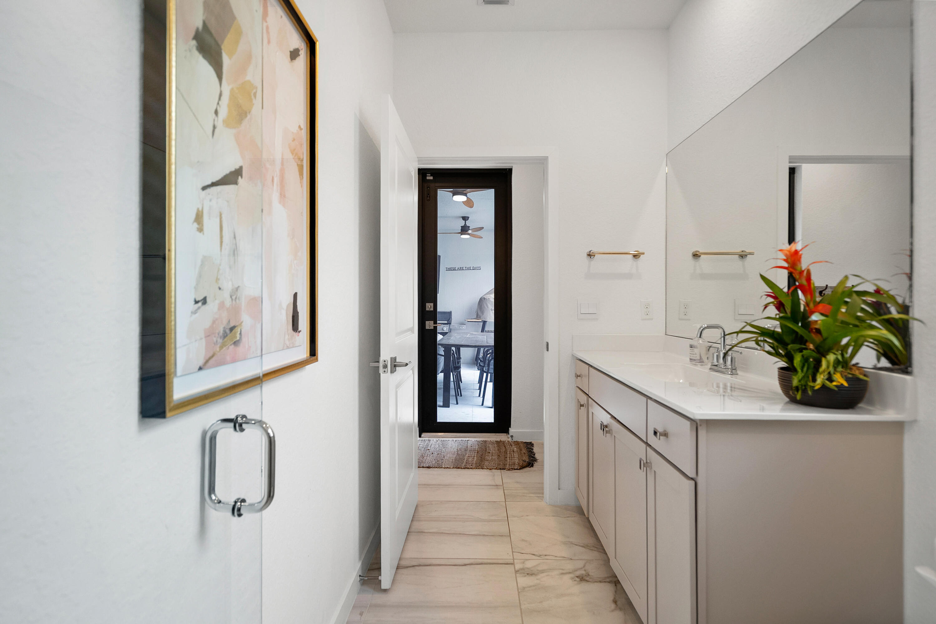 7102 Rockwood Road Jupiter, FL 33458 - Photo 22 of 41 Guest Bath with Cabana Door