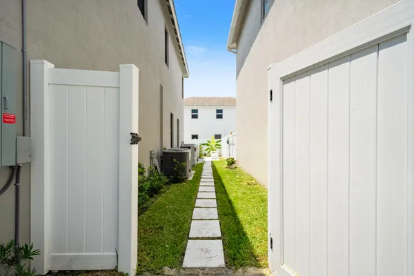 a view of a house with a small yard