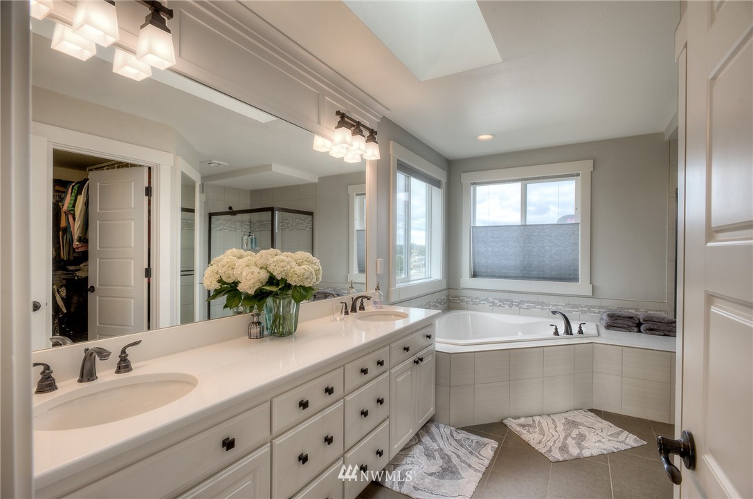 22008 43rd Drive Southeast Bothell, WA 98021 - Photo 14 of 25 a bathroom with a sink double vanity and a mirror