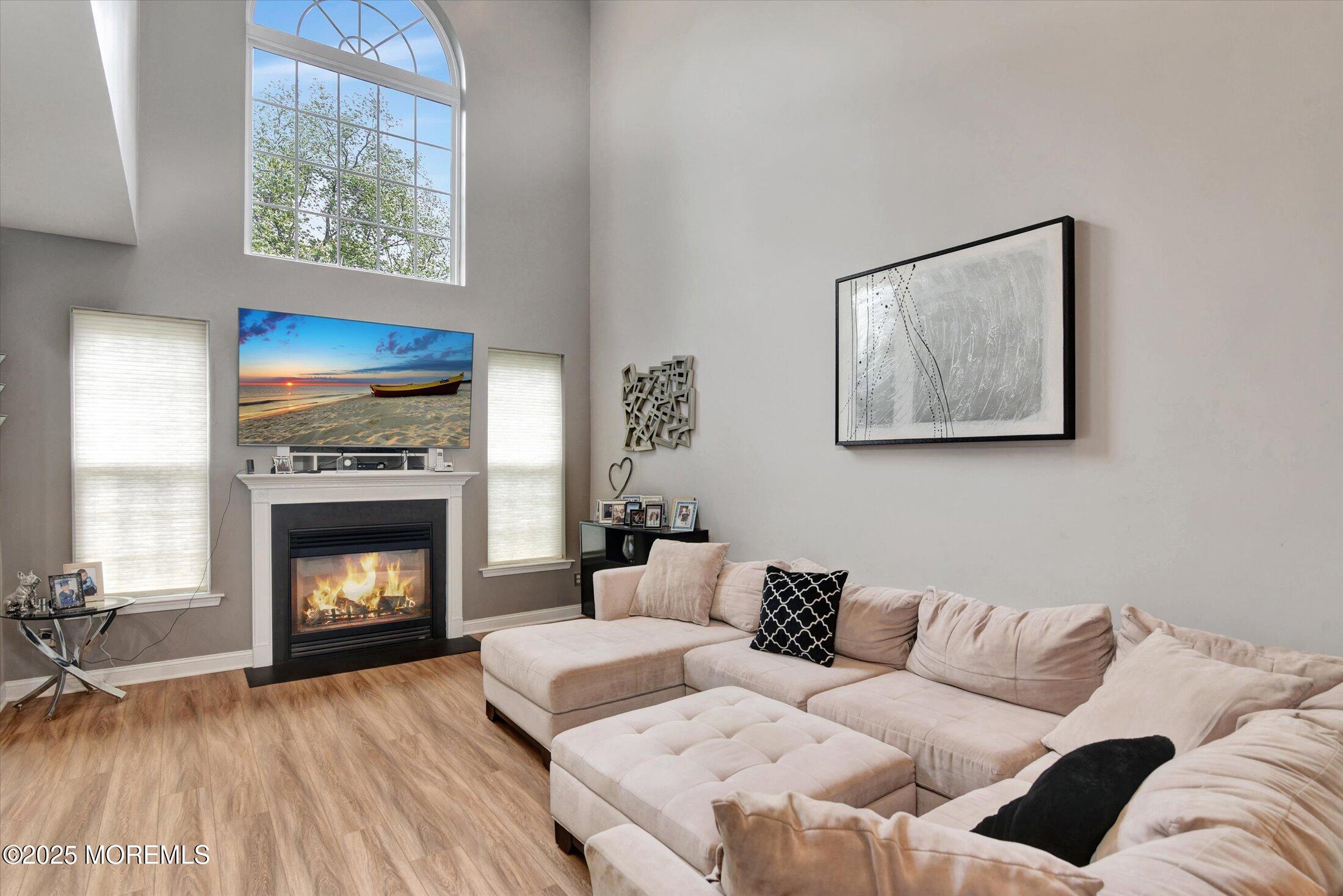 45 Brookfield Drive Jackson, NJ 08527 - Photo 11 of 39 a living room with furniture and a fireplace