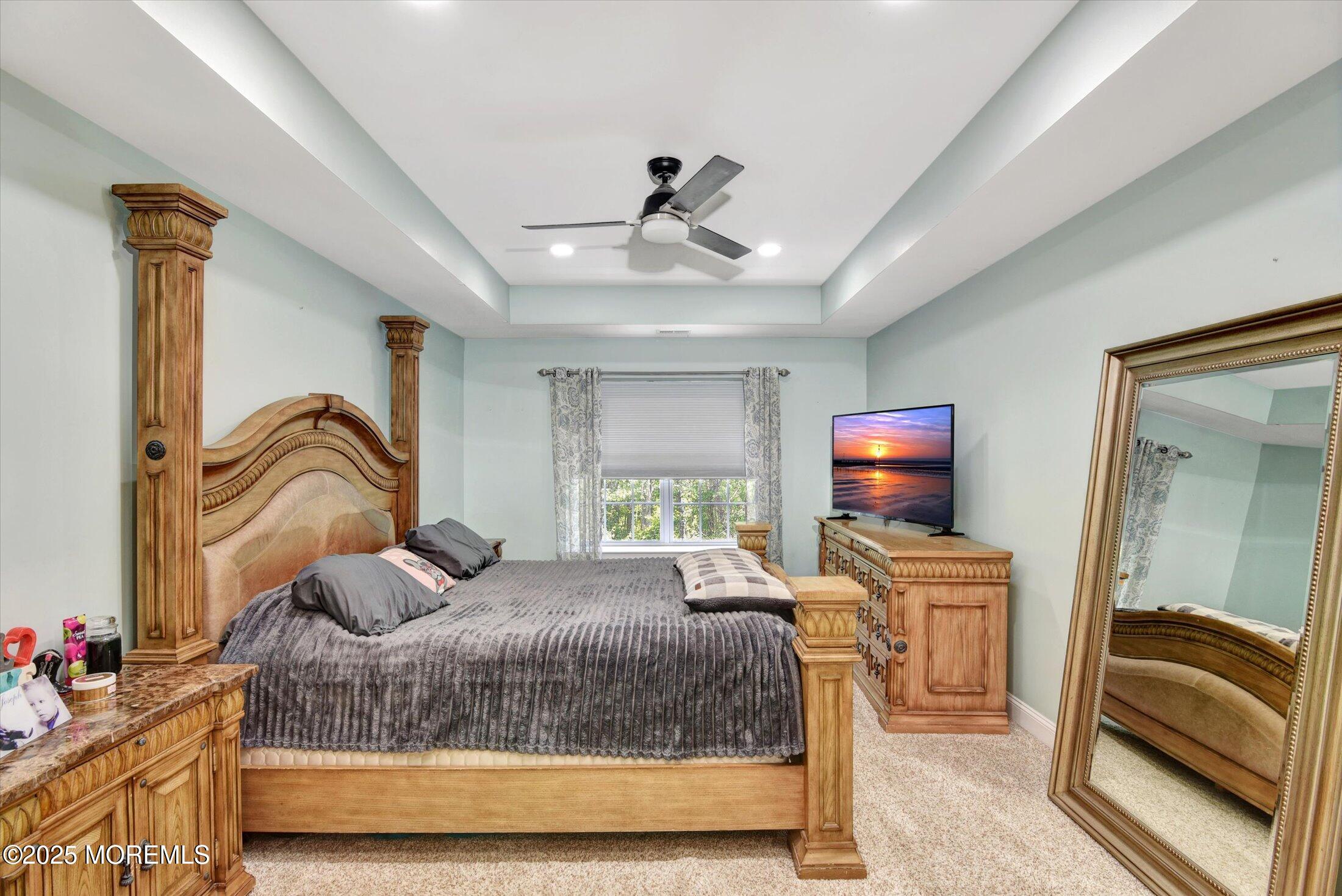 45 Brookfield Drive Jackson, NJ 08527 - Photo 26 of 39 a bedroom with a bed and a couch